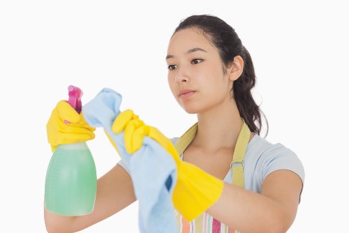 Professional carpet cleaner in Bow refreshing a living room carpet