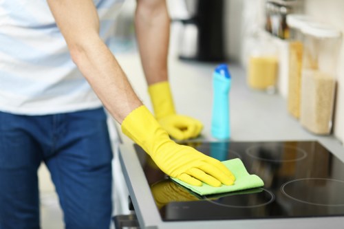 Experienced cleaner in Bow maintaining a tidy residential hallway