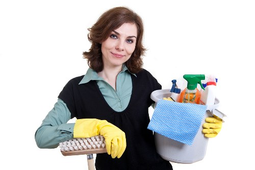 Professional cleaners servicing a modern Bow office interior